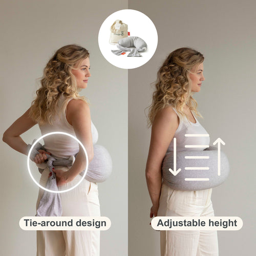 Woman using a tie-around nursing pillow with adjustable height features